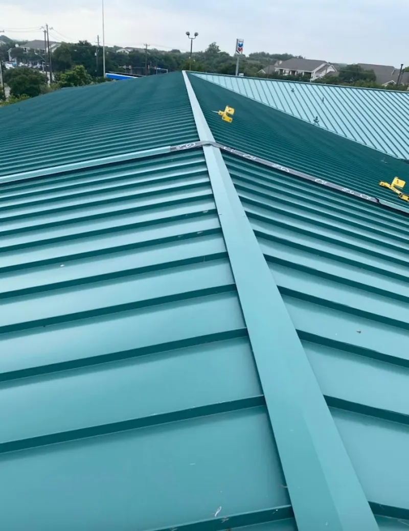 Green commercial metal roof ridge and valley for Metal Roof Repair in Kirksville
